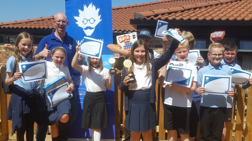 Group of children with certificates and trophies