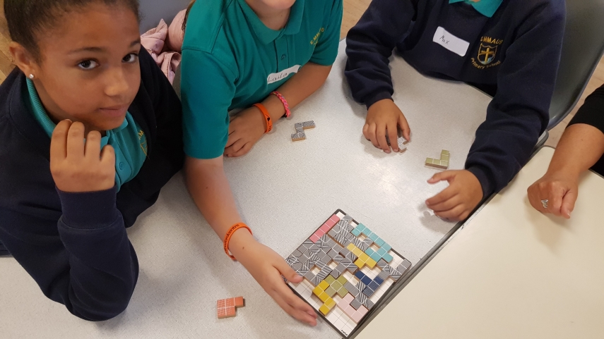 Children playing a block pieces board game