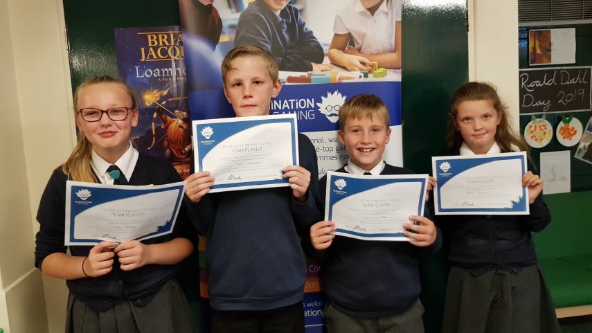 Four children with certificates