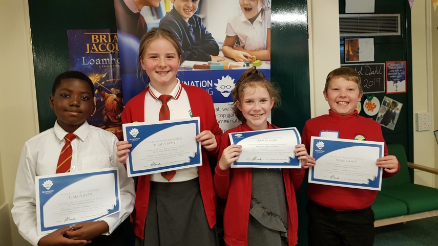 Four children with certificates