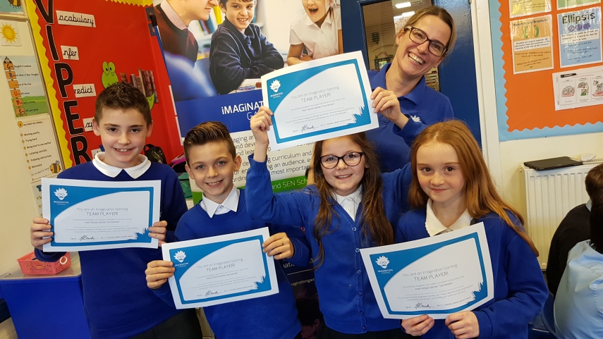Four children and one woman with certificates