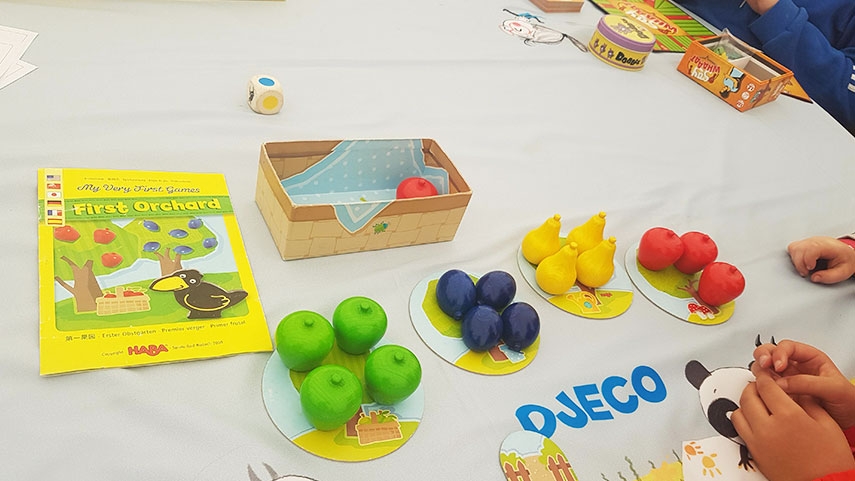 Game cards with fruit playing pieces