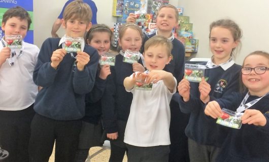 A group of children with lanyards