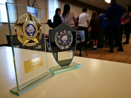 Close up of two Imagination Gaming Awards Trophies
