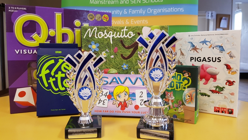 Multiple games boxes with Imagination Gaming Awards Trophies