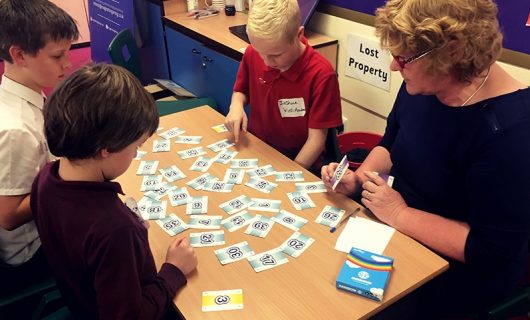 Pupils and teacher playing games